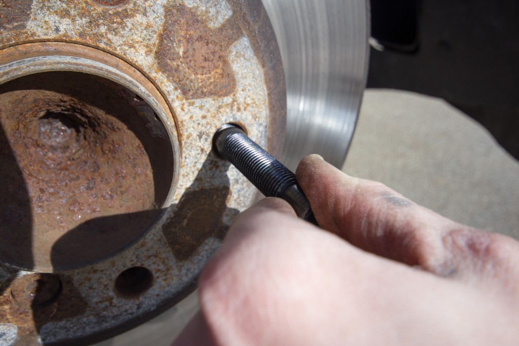 Hand-tighten the studs