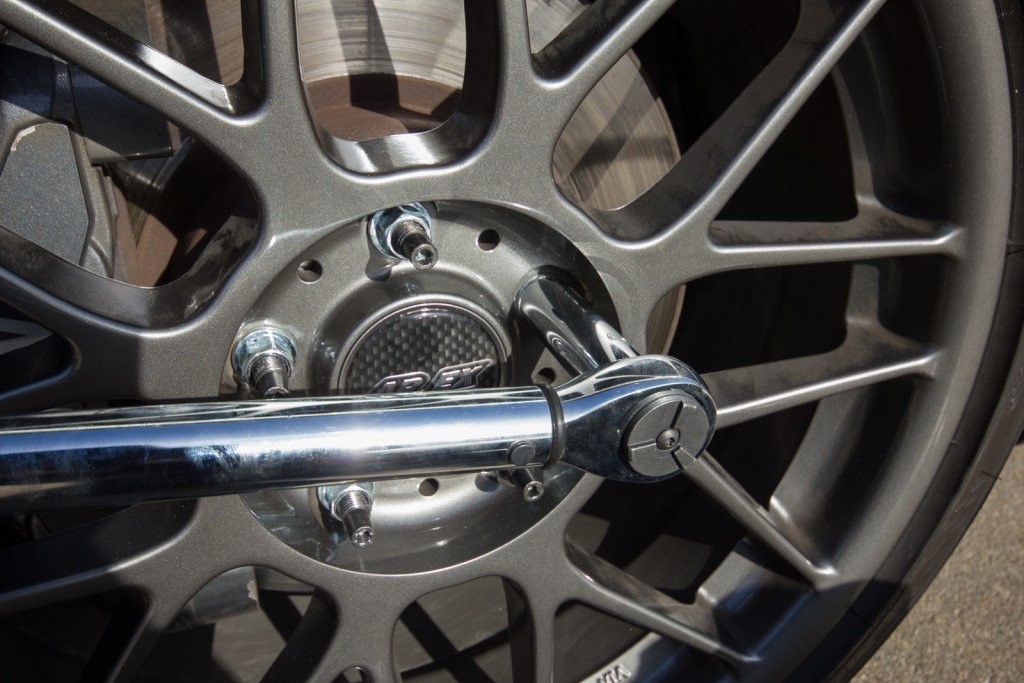 Torque down lug bolts